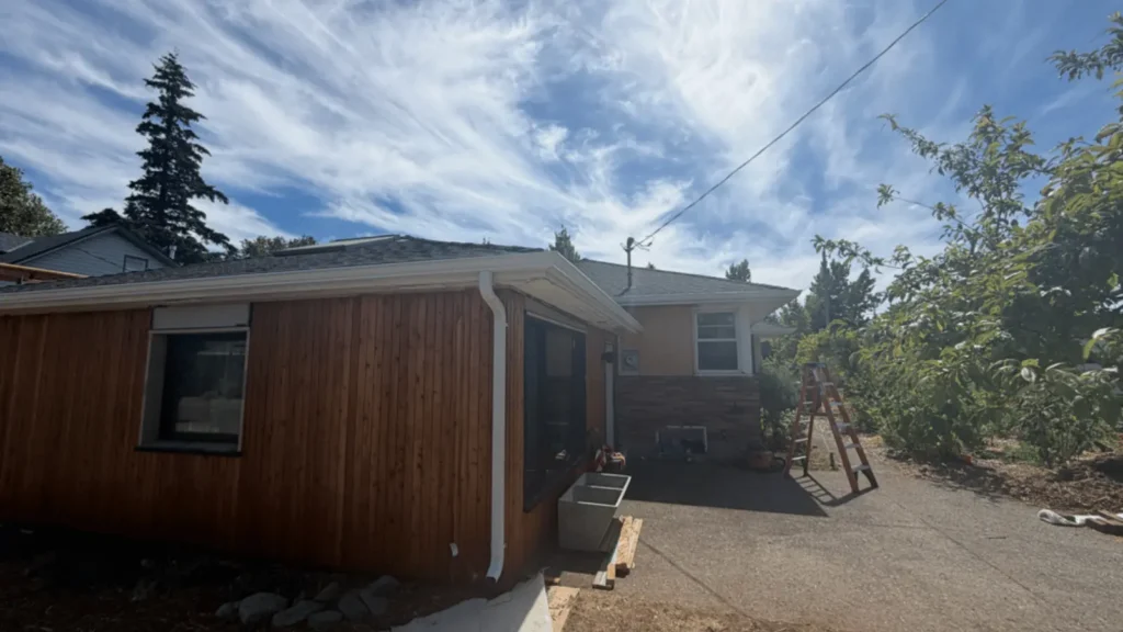White seamless aluminum gutter installed along the roofline of an Oregon home