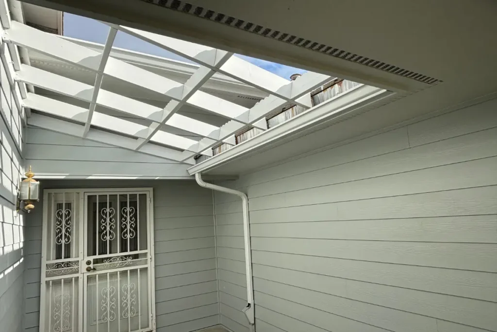 Gutter Installation St Helens 6 White gutter and downspout installed along a covered entryway in St. Helens, OR